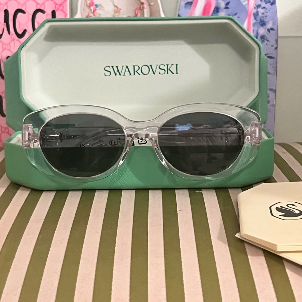 Swarovski Clear Oval Sunglasses with Dark Gray Lenses